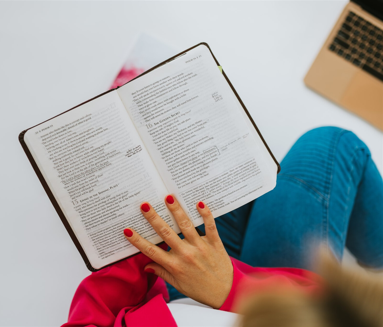 A woman reading her Bible in quiet morning light
